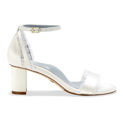Stylish and comfortable, the Perfect Block Sandal 60 in Wedding White Satin features a 60mm block heel, arch support, and adjustable ankle straps.